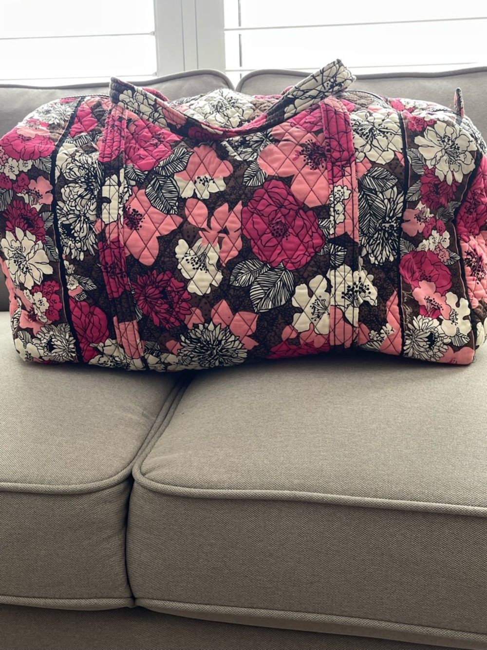 Vera Bradley large travel duffel bag in the "Mocha Rouge" floral pattern.